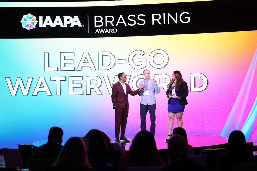 Shawn Welch, founder of SWCo, and Haleigh Pepe, Operations Assistant Manager at Water World, accept the Brass Ring Award.