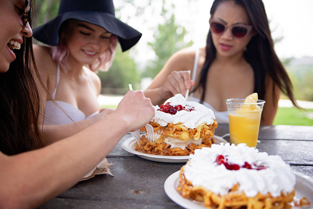 Young Ladies Eating Dessert